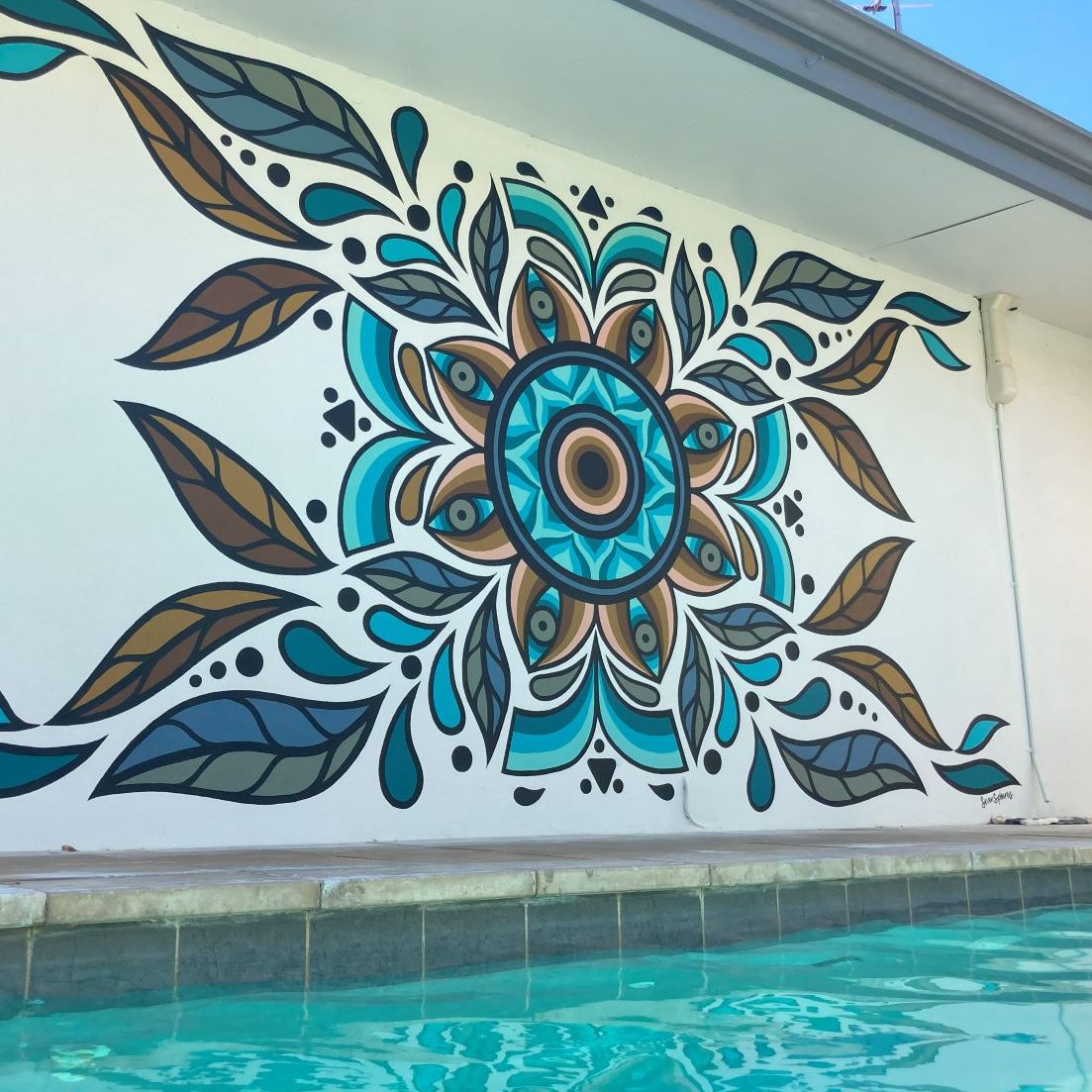 Cool blue geometric pool side mural by Cale Hosking